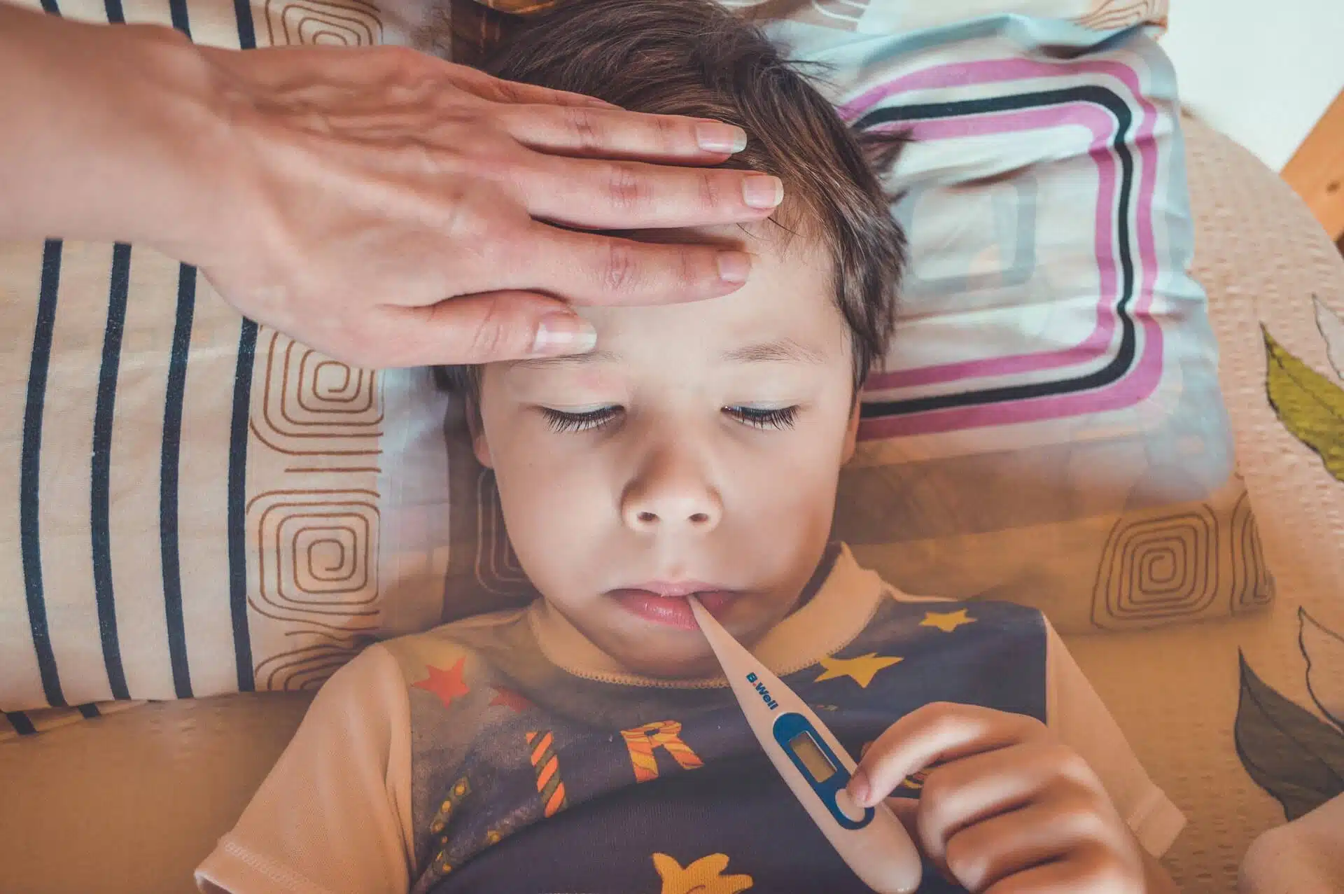 Child Having Temperature Measured With A Digital thermometer
